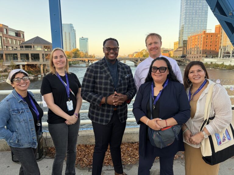 DVAN staff posing on the Blue Bridge in Grand Rapids for the Annual Candlelight Vigil